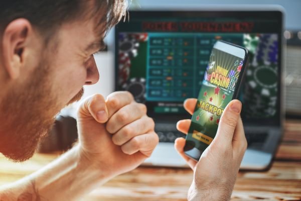 Filipino player browsing cow88 on a mobile phone